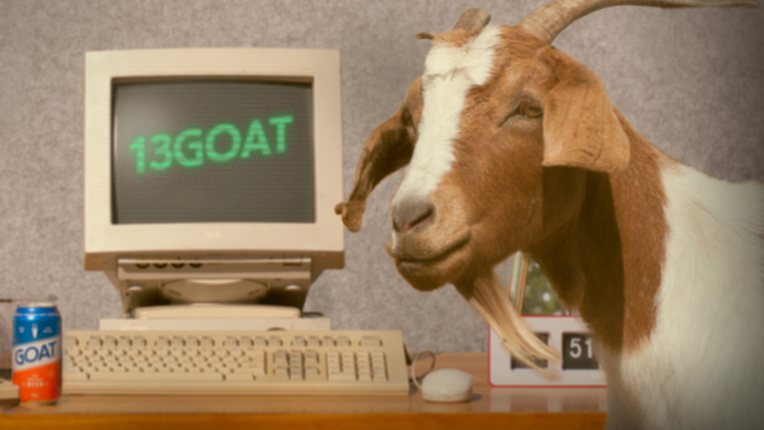 goat in front of old computer with the words 13goat