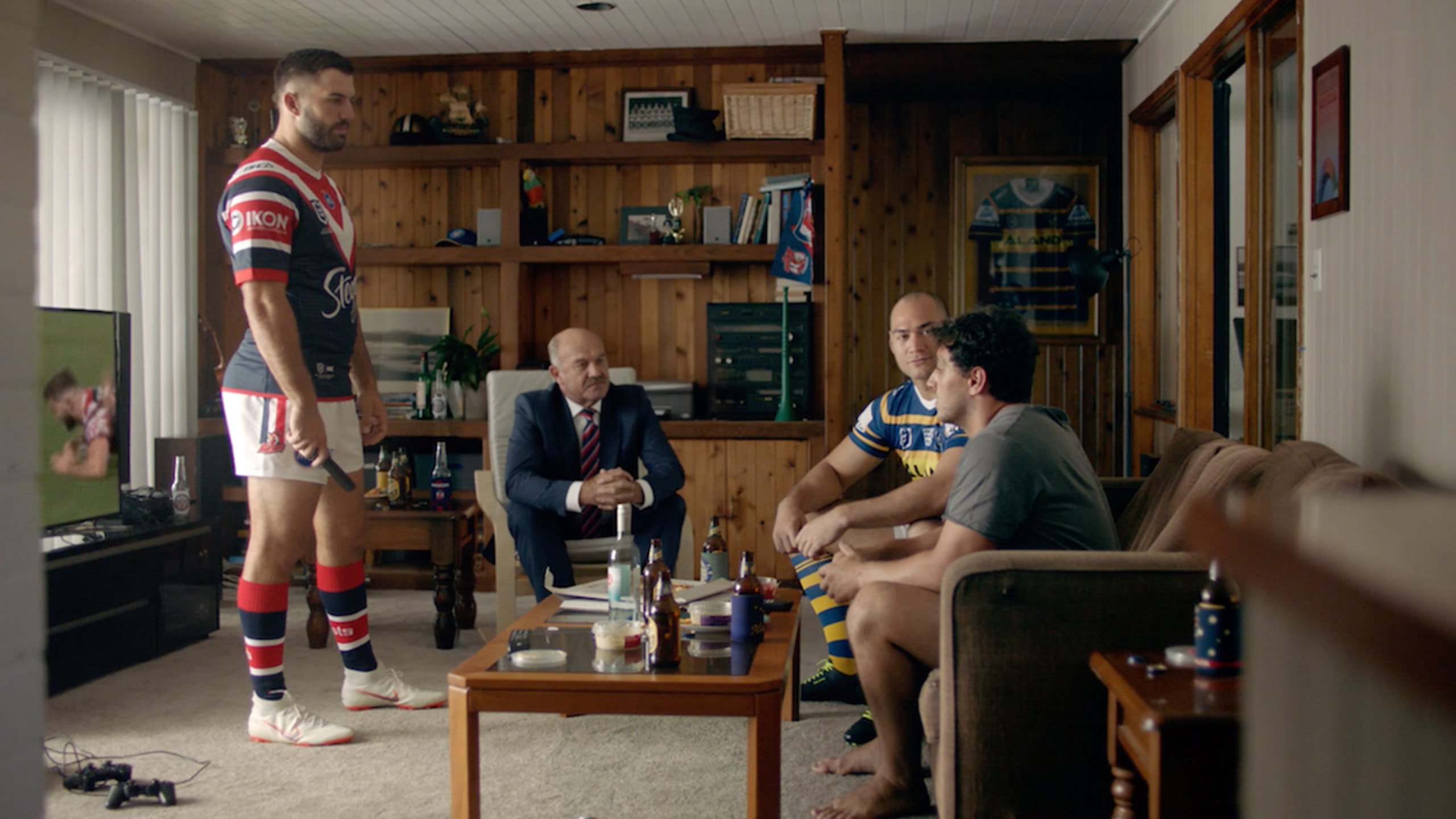 NRL player in man living room