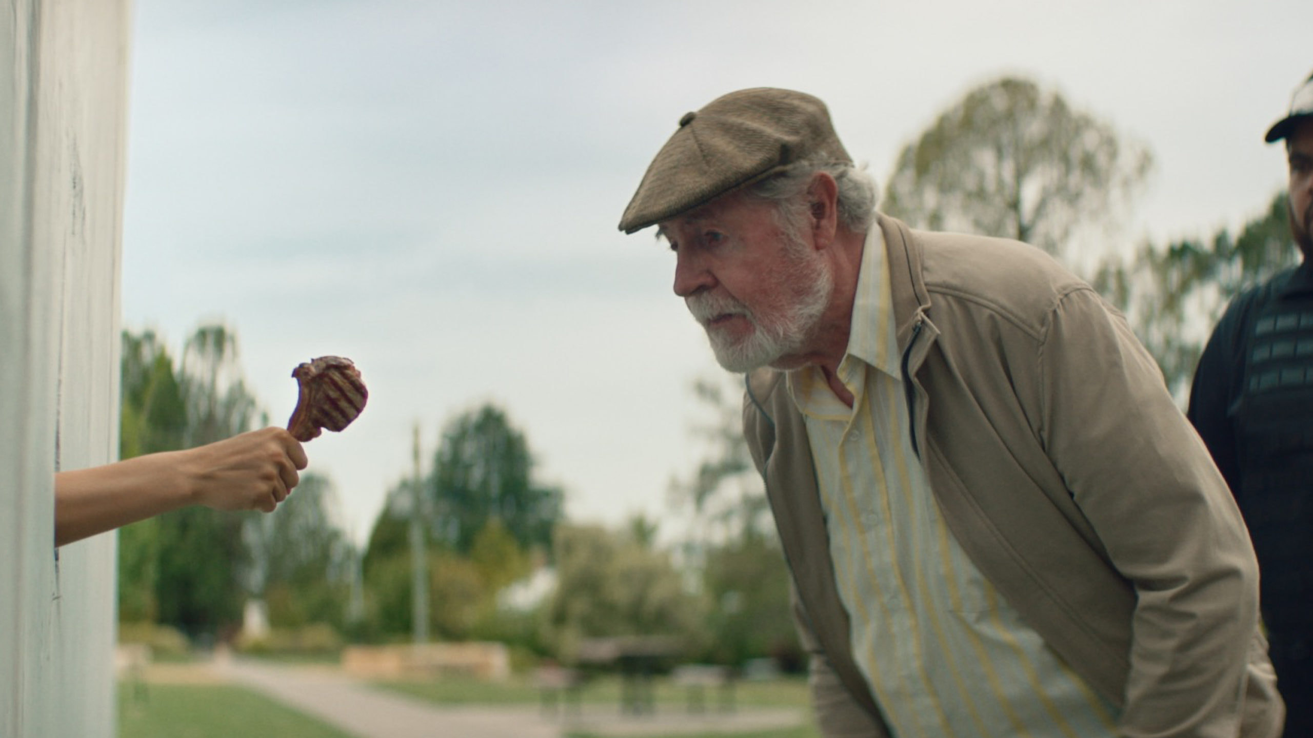 older man overwhelmed by the irresistible aroma of lamb