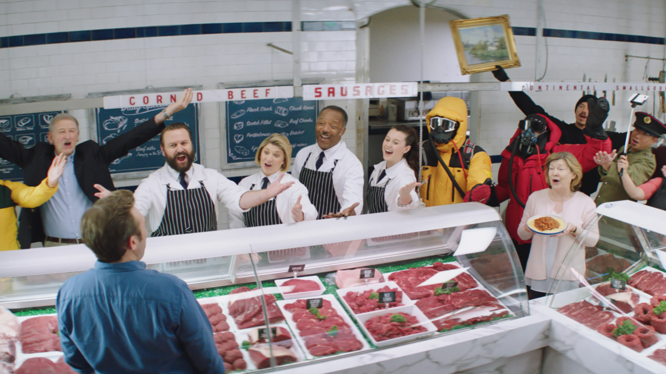 People singing in a butchers