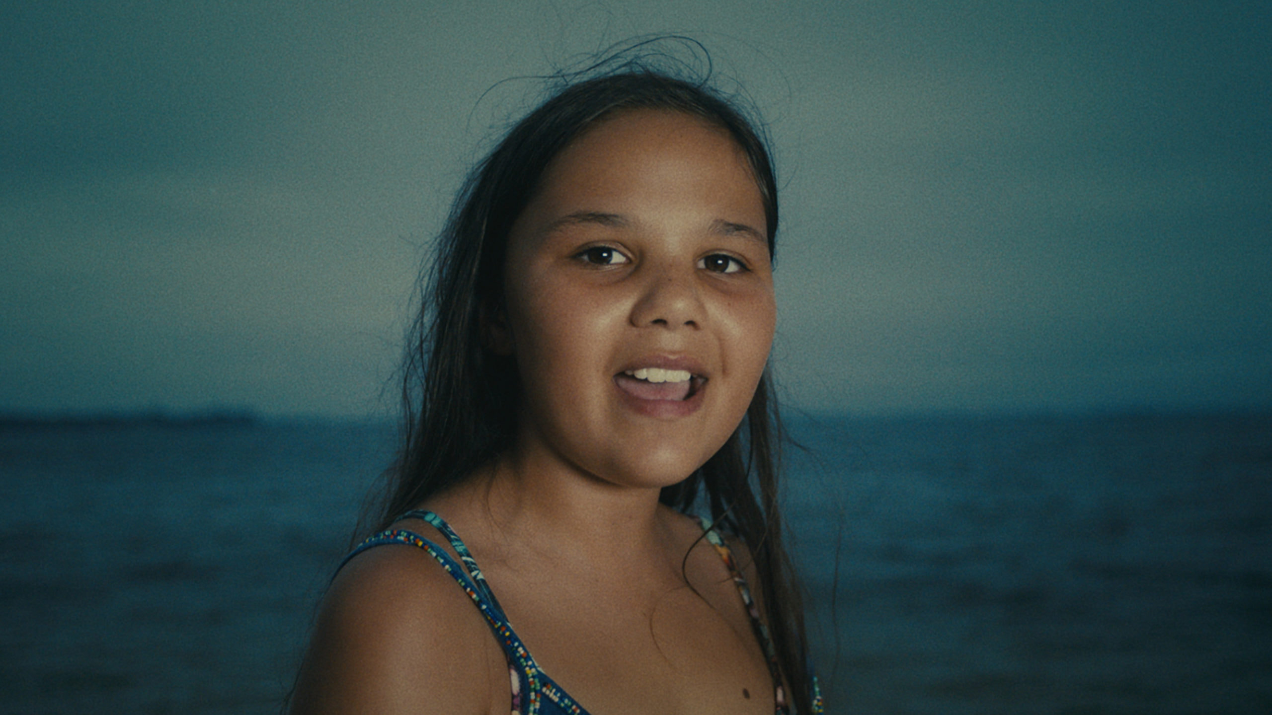 Young girl in front of ocean