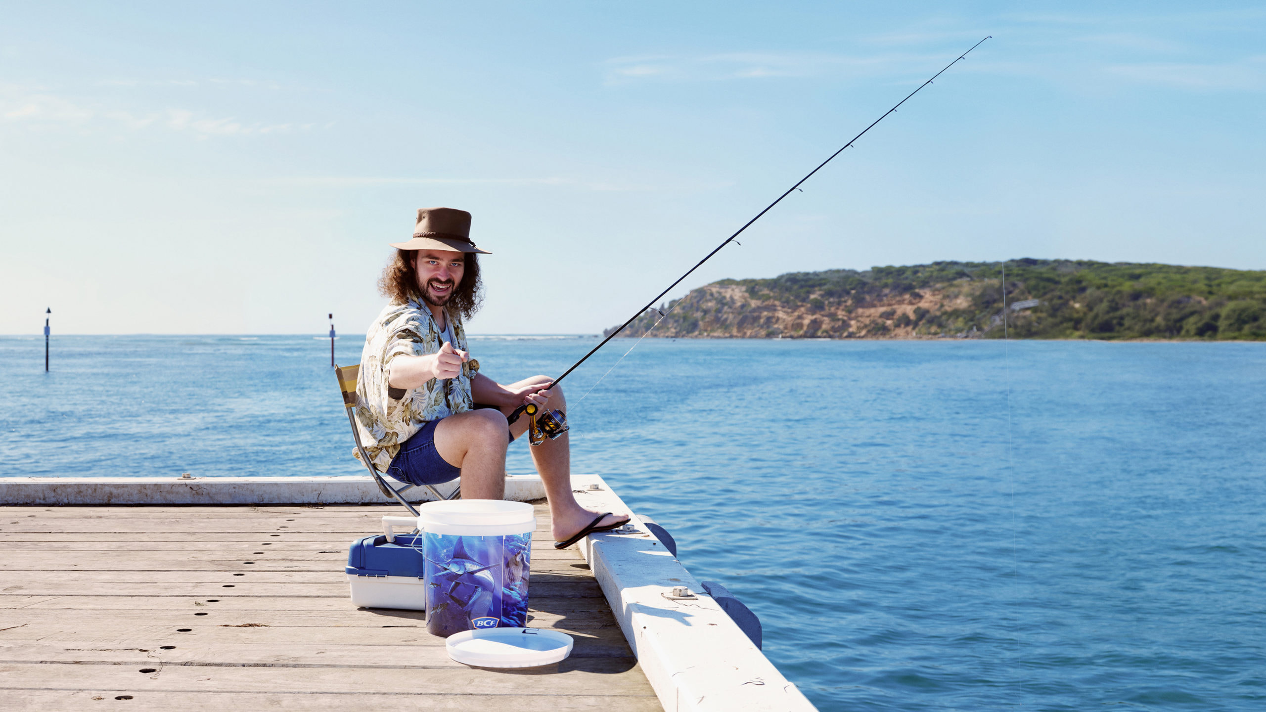 man fishing on dock